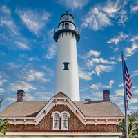 Buy canvas prints of White Lighthouse Behind Brick House by Darryl Brooks