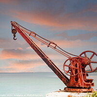 Buy canvas prints of Old Red Rusty Crane on Shore at Dusk by Darryl Brooks