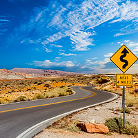 Buy canvas prints of Road Sign for Curves in Desert by Darryl Brooks