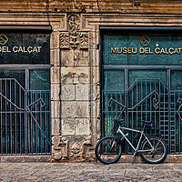Buy canvas prints of Bike Against Museu Del Calcat by Darryl Brooks