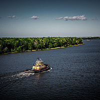Buy canvas prints of Dark Tugboat on River by Darryl Brooks