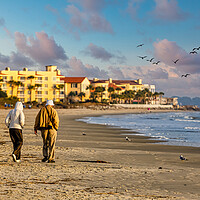 Buy canvas prints of Old Couple Walking up Empty  Beach by Darryl Brooks