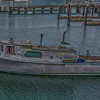Buy canvas prints of Old Fishing Boat Tied to Pier by Darryl Brooks