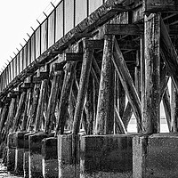 Buy canvas prints of Supports on Old Abandoned Pier by Darryl Brooks