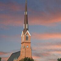 Buy canvas prints of Red Stucco Steeple Rising in Early Morning Light by Darryl Brooks