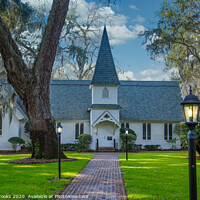 Buy canvas prints of Small Church Past Brick Walk and Green Lawn with Lamps by Darryl Brooks