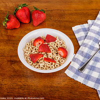 Buy canvas prints of Toasted Oat Cereal and Strawberries on Table by Darryl Brooks