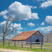 Buy canvas prints of Old Barn Beyond Fence by Darryl Brooks