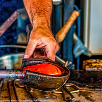 Buy canvas prints of Glass Blower Working Hot Glass by Darryl Brooks
