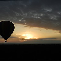 Buy canvas prints of Photo of an Air Balloon at sunset over the plains  by Matt Cass