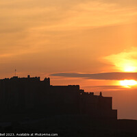 Buy canvas prints of Bamburgh Castle Sunset Silhouette by Andrew Bell