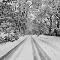 Buy canvas prints of Snowy Road with Bright Red Postbox by Sarah Smith