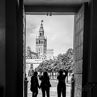Buy canvas prints of Taking photographs of the Giralda in Seville by KB Photo