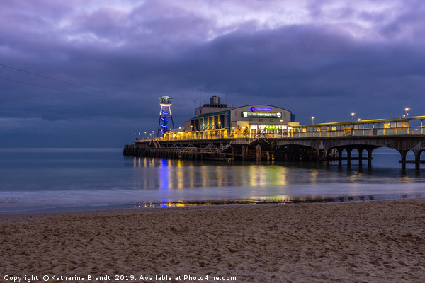 Bournemouth Pier illuminated at night Picture Board by KB Photo