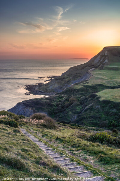 Sunset over Chapman's Pool in Dorset Picture Board by KB Photo