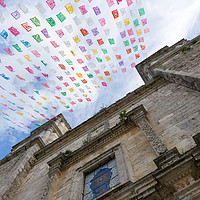 Buy canvas prints of Flags flying at a Hispanic Church by Stephen Dryburgh