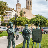 Buy canvas prints of Bronze statues on Sitges promenade by Kevin Hellon