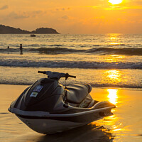 Buy canvas prints of Jet ski at sunset on Patong beach by Kevin Hellon