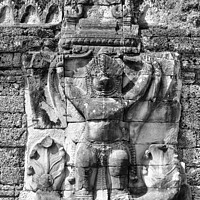 Buy canvas prints of Stone carving on temple building by Kevin Hellon