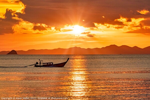 Long tail boat on the Andaman Sea at sunset  Picture Board by Kevin Hellon