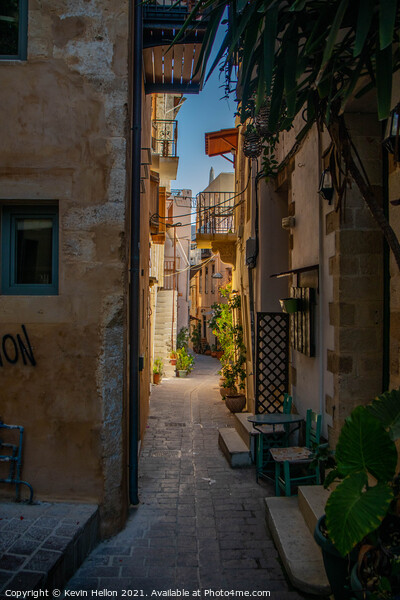 Narrow street in Chania Picture Board by Kevin Hellon