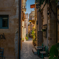 Buy canvas prints of Narrow street in Chania by Kevin Hellon