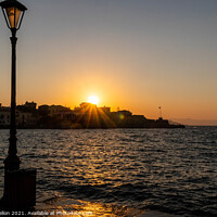 Buy canvas prints of Sun setting over the Venetian Harbour, Chania by Kevin Hellon