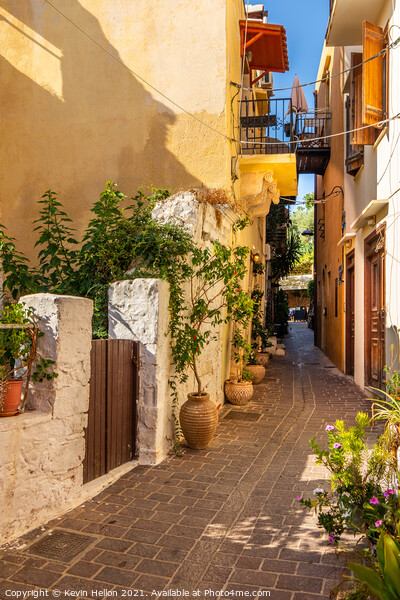 Narrow sreet in old Chania Picture Board by Kevin Hellon