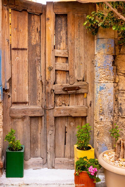 Colourful plant containers and old wooden doors, Picture Board by Kevin Hellon