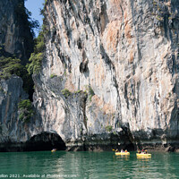 Buy canvas prints of Tourists in inflatble canoes exploring Koh Hong, hang Nga Bay, h by Kevin Hellon