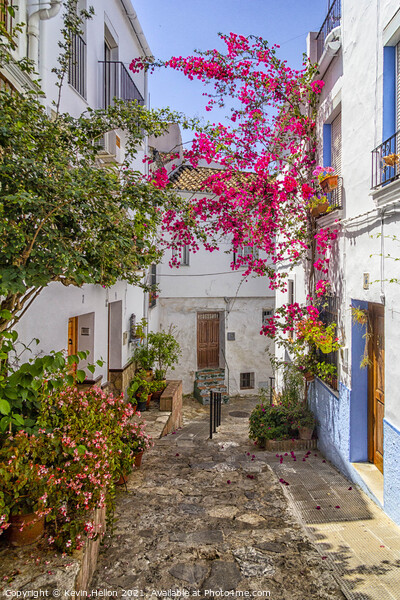 Narrow, hilly street in Ubrique Picture Board by Kevin Hellon