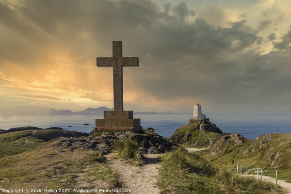 St Dwynwen’s Cross and Tyr Mawr lighthouse at sunset,  Picture Board by Kevin Hellon