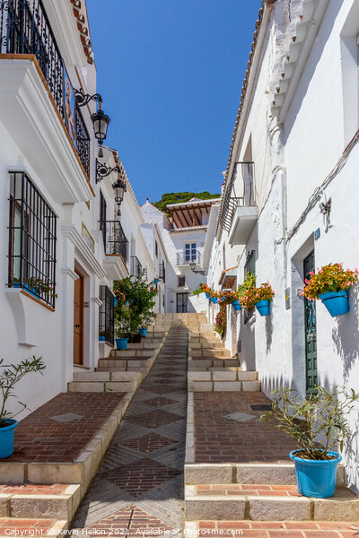 Steep street with blue plantpots, Mijas Picture Board by Kevin Hellon