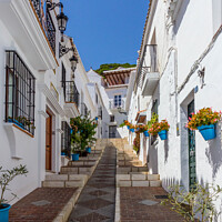 Buy canvas prints of Steep street with blue plantpots, Mijas by Kevin Hellon
