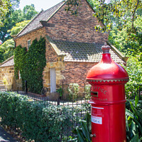 Buy canvas prints of James Cooks cottage and pillar box by Kevin Hellon