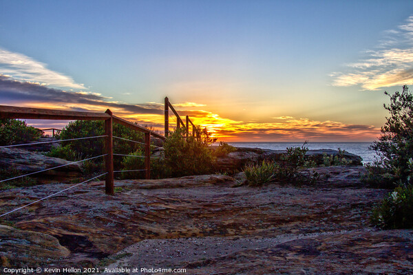 Sunrise over the cliffs Picture Board by Kevin Hellon