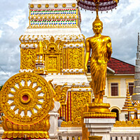 Buy canvas prints of Buddha image and spire, Wat Phra That Phanom by Kevin Hellon