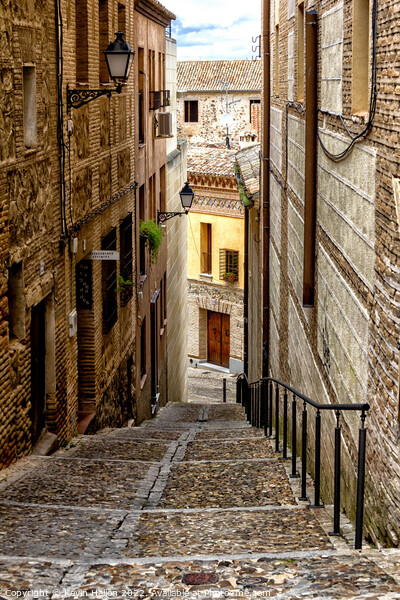 Steep, narrow street in Toledo, Spain Picture Board by Kevin Hellon