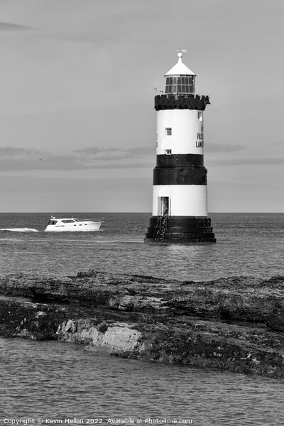 Boat passing by Penmon Lighthouse, Picture Board by Kevin Hellon