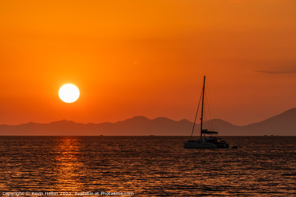 Catamaran moored in Krabi at sunset Picture Board by Kevin Hellon