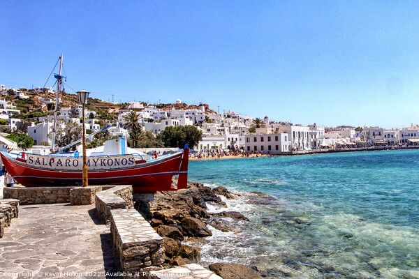 Clear waters of the Mediterranean sea and harbour Chora, Mykonos Picture Board by Kevin Hellon