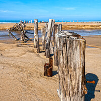Buy canvas prints of Posts in the sand by Kevin Hellon