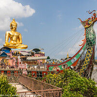 Buy canvas prints of Buddah statue on boat on the Mekhong River  by Kevin Hellon