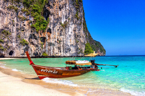 Traditional long tail fishing boat beached on Koh Lao Liang, Tra Picture Board by Kevin Hellon