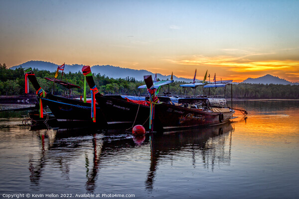 Long tail boats moored in Psk Meng, Trang Province at sunrise. Picture Board by Kevin Hellon