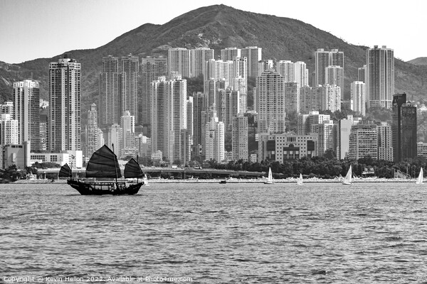 Junk sailing in Victoria Harbour, Hong Kong Picture Board by Kevin Hellon