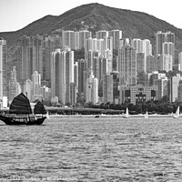 Buy canvas prints of Junk sailing in Victoria Harbour, Hong Kong by Kevin Hellon
