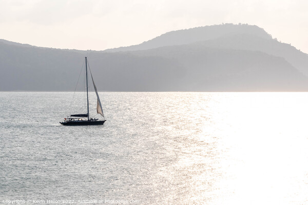 Yacht sailing towards the sun, Cape Panwa, Phuket, Thailand Picture Board by Kevin Hellon