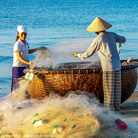 Buy canvas prints of Folding the nets, Mui Ne, Vietnam by Kevin Hellon