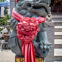 Buy canvas prints of Temple lion statue outside a Chinese temple, by Kevin Hellon